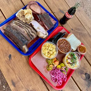 a tray of food and a bottle of coke