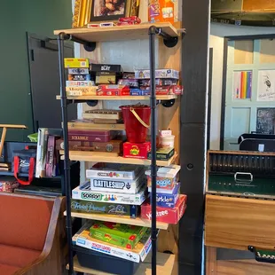 a shelf of board games