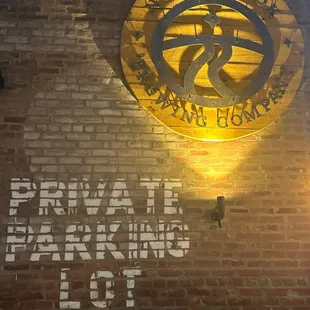 a brick wall with a circular logo