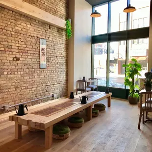 a brick wall and wooden benches