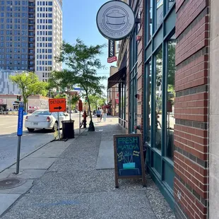 a sidewalk in a downtown area