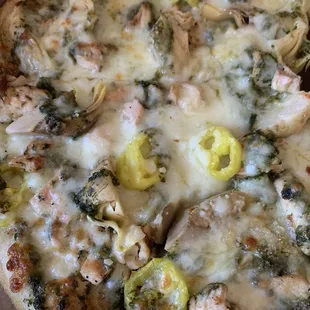 Capital pizza with chicken, pesto, artichoke. We added banana peppers