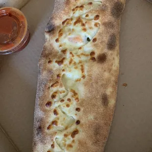 Calzone with shrimp and broccoli