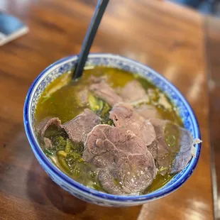 A10. Pickled Peppers and Sauerkraut Beef Noodle Soup with Knife Sliced Noodles