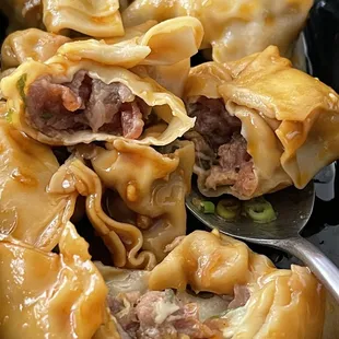 Pork dumpling in spicy sauce