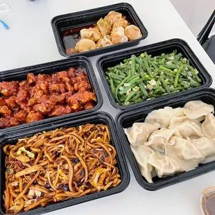 H6. Spicy Pork Wontons, E4. Sauteed String Beans, E5. Orange Chicken, N11. Lao Gan Ma Fried Noodles, H9. Cabbage and Pork Dumplings