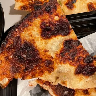 Green onion pancake. Burnt. Inedible. Unacceptable