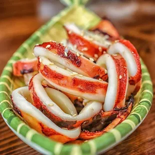 a plate of crab legs and onions