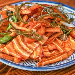 a plate of food on a wooden table