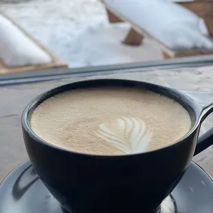 a cup of coffee on a saucer