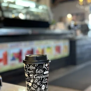 a cup of coffee on a counter