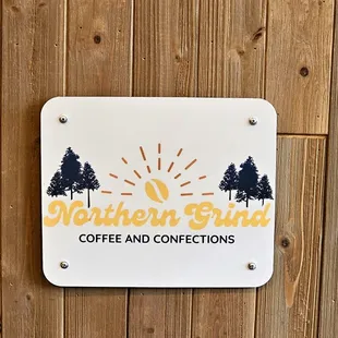 a sign on a wooden wall