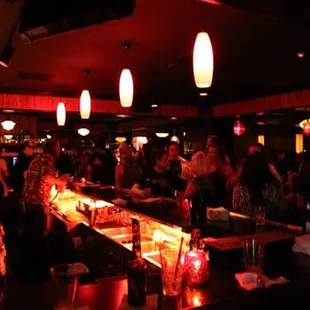 people sitting at a bar