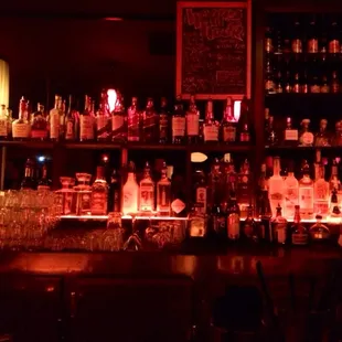a bar filled with liquor bottles