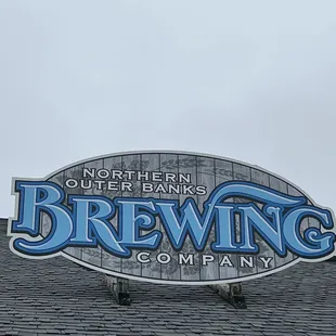 a sign on the roof of a building