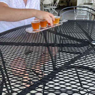 a man sitting at a table outside