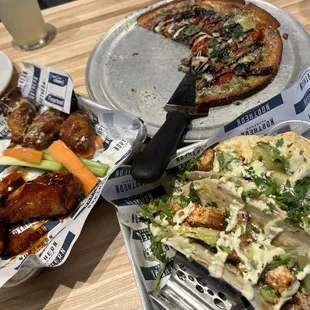 Chicken avocado tacos, wings, pesto pizza