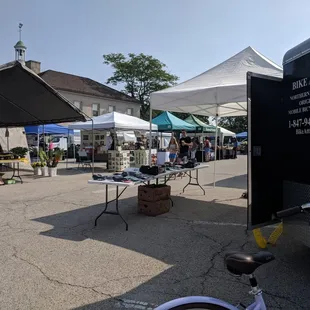 a bicycle parked in front of a tent