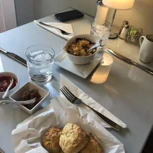 Freshly baked scones with apple butter and strawberry preserves