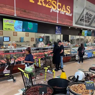 people shopping in a grocery store