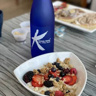 Steel cut oatmeal with granola and berries.