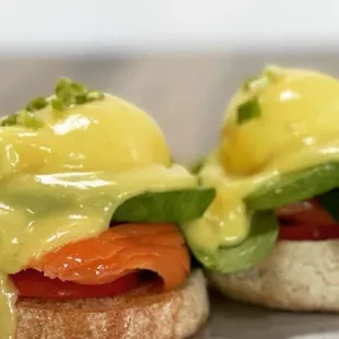 two eggs benedicts with salmon and avocado