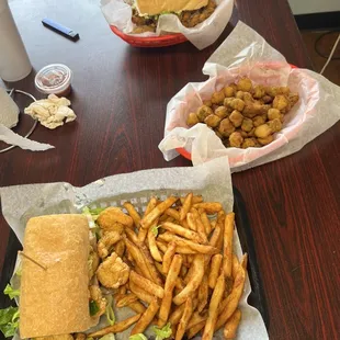 a sandwich and fries on a table