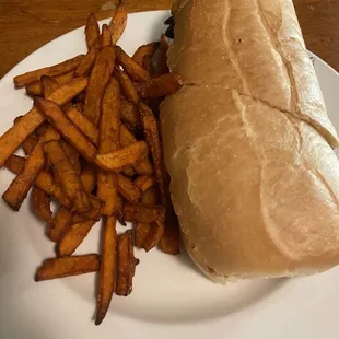 Rib Philly Cheesesteak Sandwich with sweet potato fries. (Au Jus not pictured)