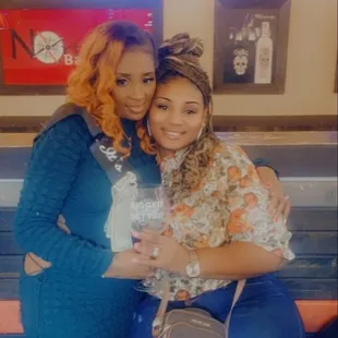 two women hugging each other