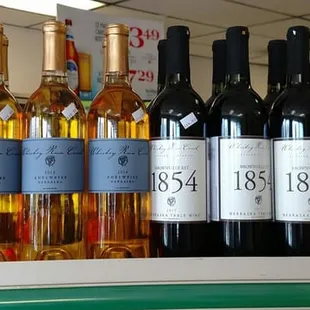 a variety of wine bottles on a shelf