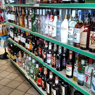 a wide selection of alcohol on shelves