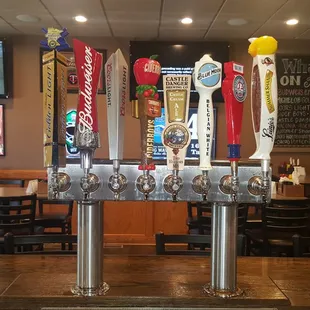 a row of beer taps