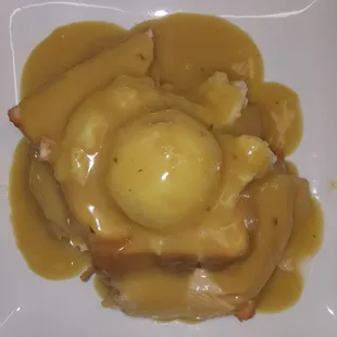 a plate of food with gravy