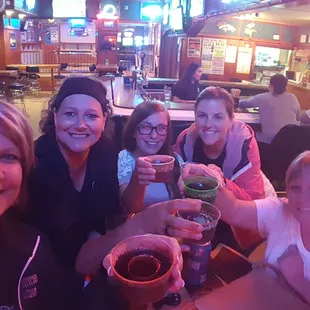 a group of women sitting at a table
