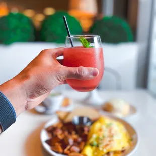 a person holding a drink