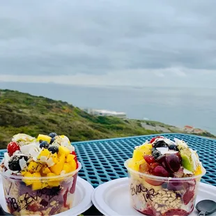 two bowls of fruit and yogurt