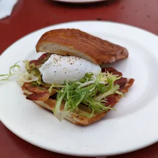 Bacon and poached egg sandwich