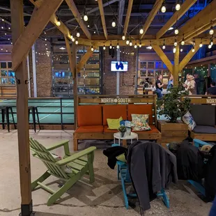 a man sitting under a pergol roof