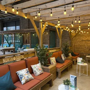 a lounge area with couches and tables