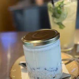 a jar of yogurt and a drink