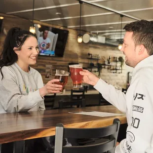 a man and woman toasting