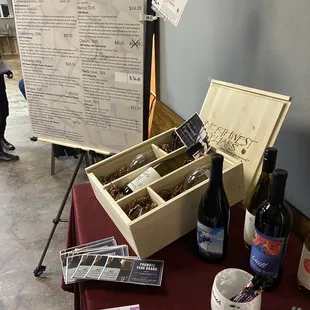 a wine tasting table with wine bottles