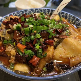 a bowl of stew with meat and vegetables