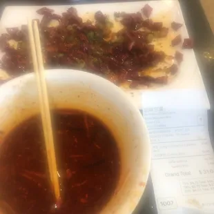 Leftover chili oils/pods next to receipt