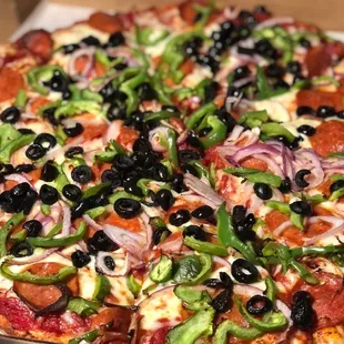 Pepperoni, onion, green pepper and black olive pizza. Yum!