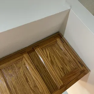 These cabinets are a safety hazard. They shouldn't be separating from the ceiling.