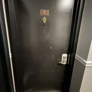 Our main door. No frame for the handle and it's scuffed up.