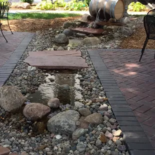 a patio with a water feature