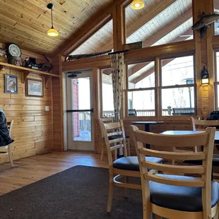 a dining room with a table and chairs
