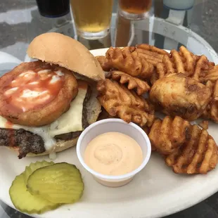 a burger and fries on a plate